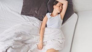 Woman swearing in her bed