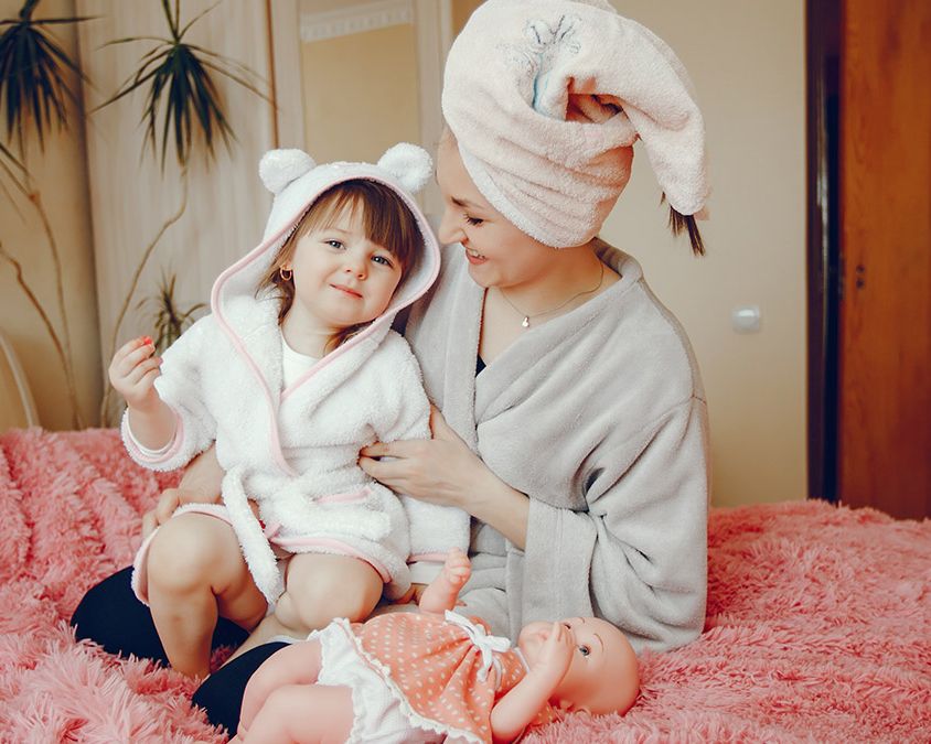 Mother and daughter on a bed